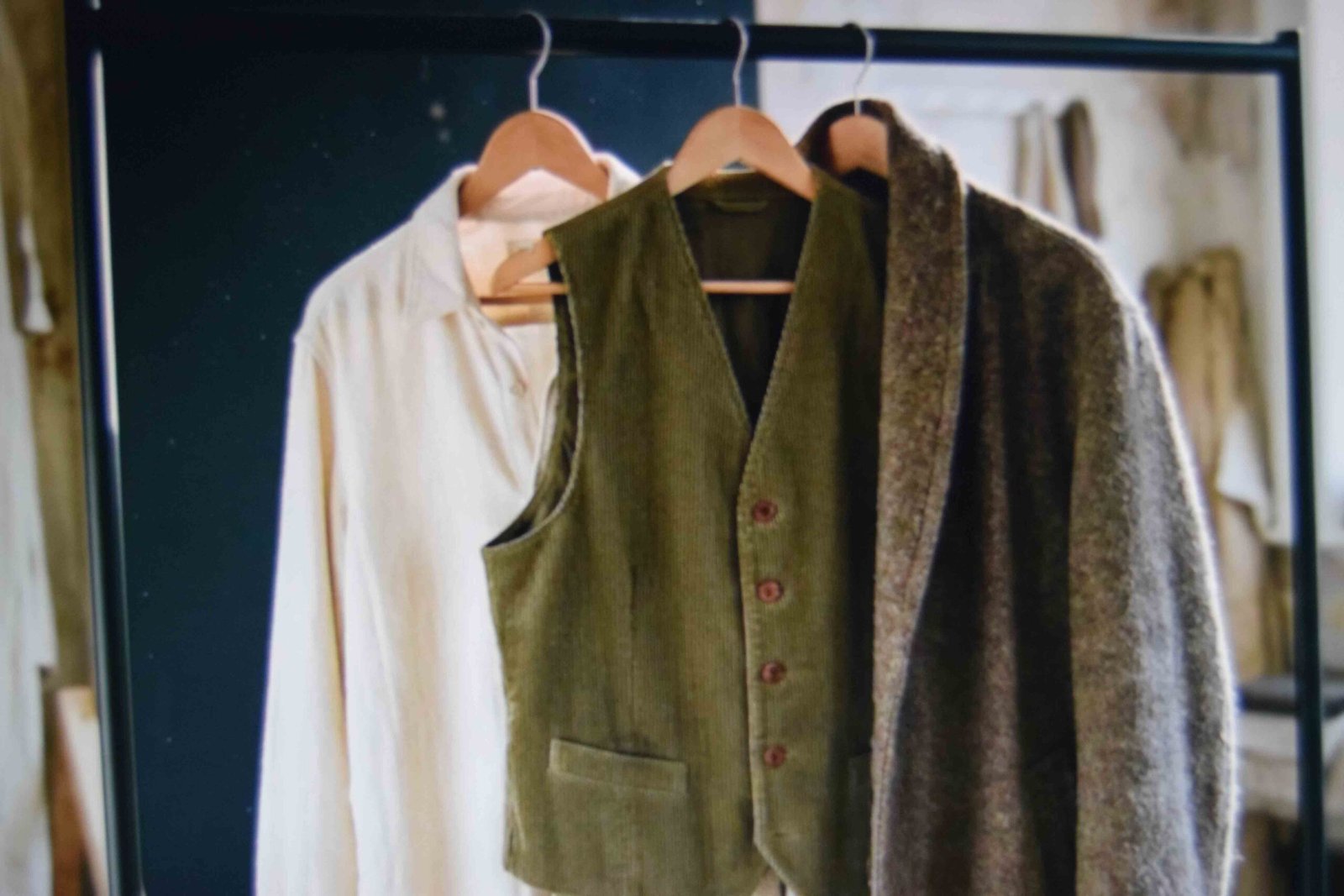 Layered shirt waistcoat and coat hung together to build texture