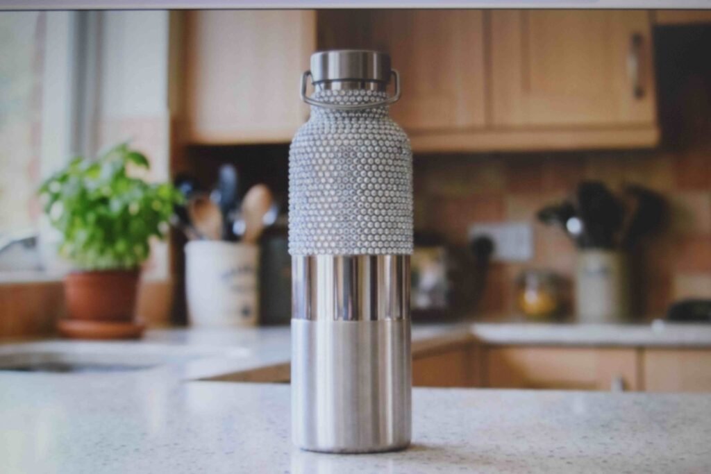 Bedazzled water bottle with a bare grip zone left in the middle