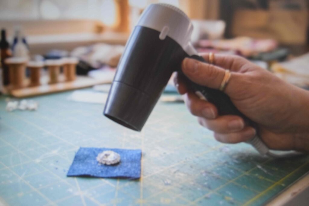 Warming a stone with a hairdryer to reposition it