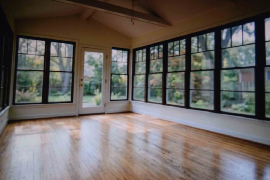 An empty sunroom being considered as a home learning space before any furniture goes in