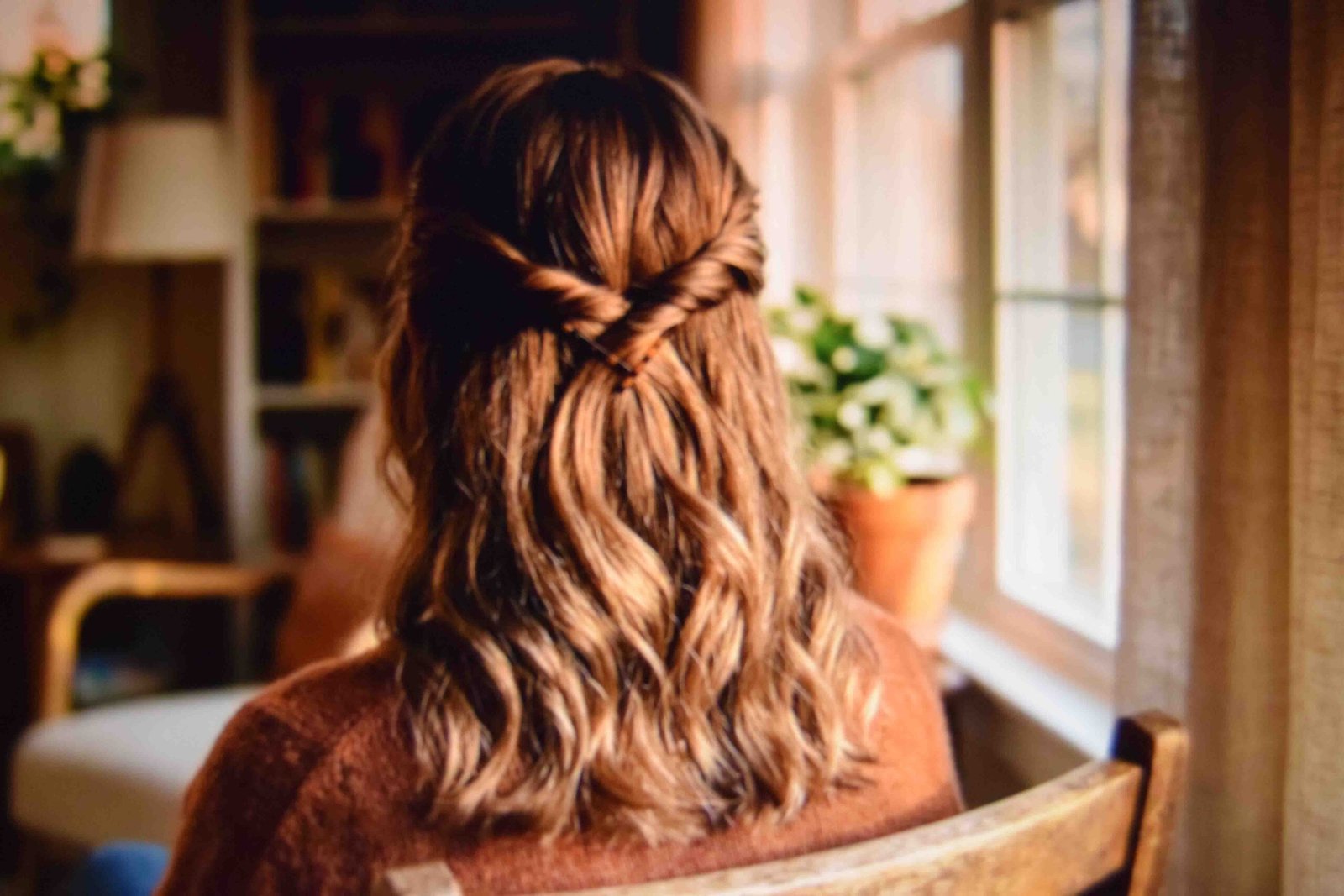 Two twisted sections crossed and pinned at the crown on medium length hair
