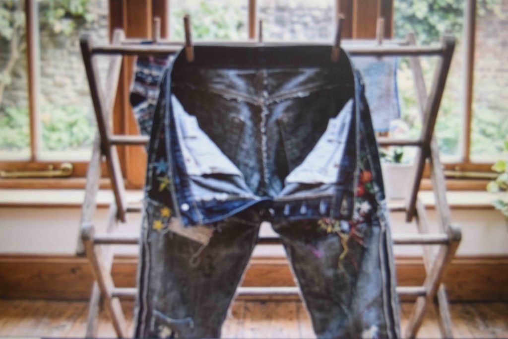 Painted jeans turned inside out and hung to air dry after a gentle wash