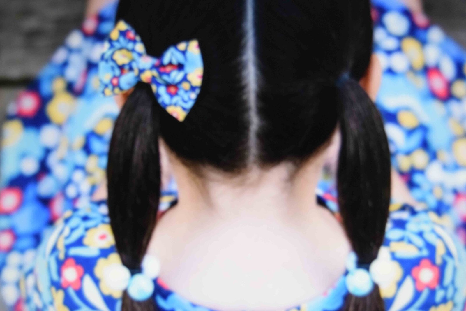 Ponytails finished with matching ballies and a single bow at the base