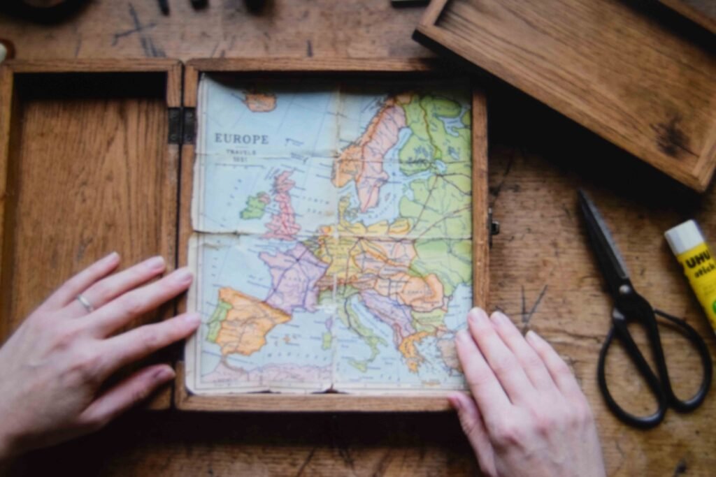 A printed hometown map being fitted as a lining inside a senior memory box