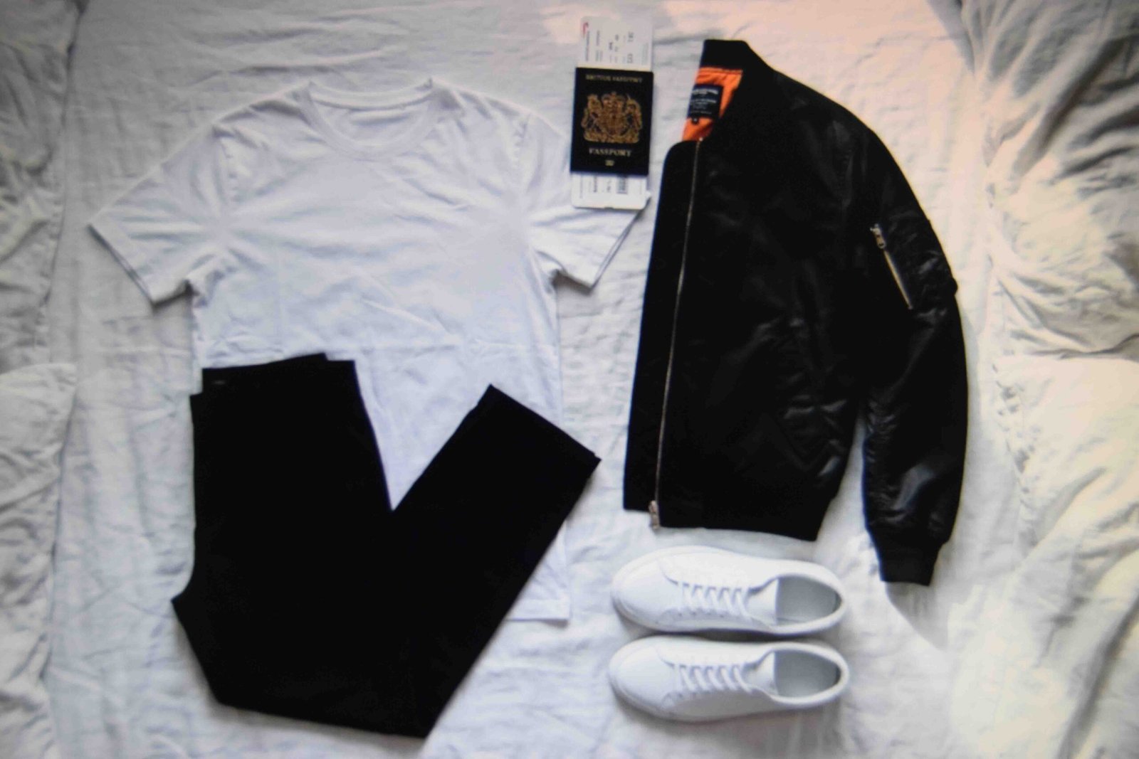 The base airport travel outfit women can build on laid out before packing