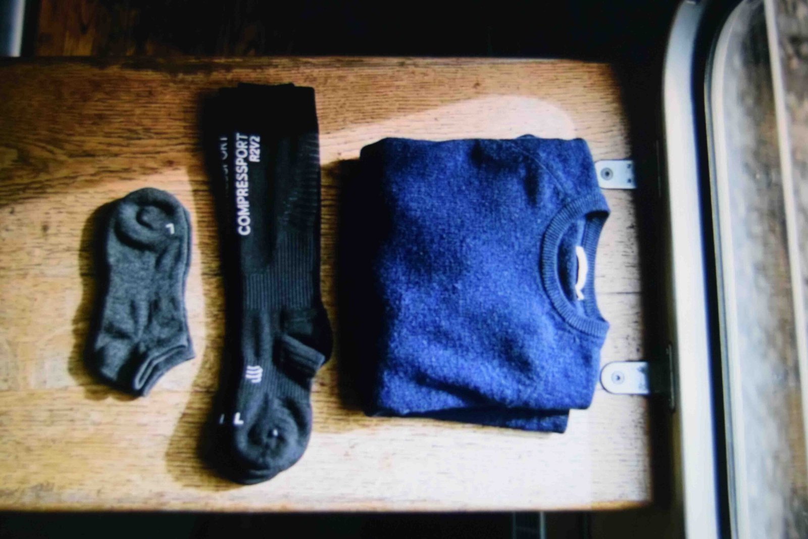 Two sock options packed as part of practical comfy airport outfit ideas