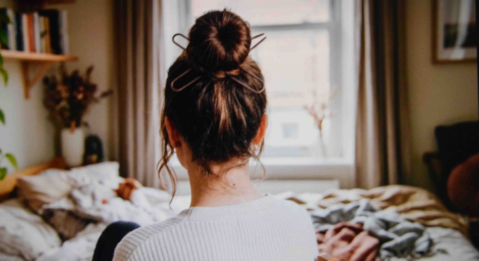 A high knotted bun as one of the easiest hairstyles for greasy hair