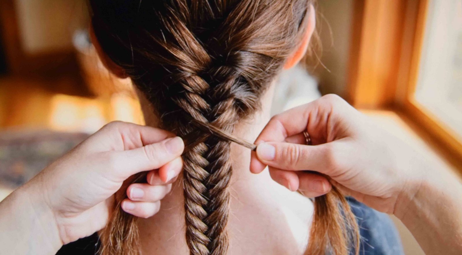 A fishtail braid taking shape on day three hair with plenty of grip