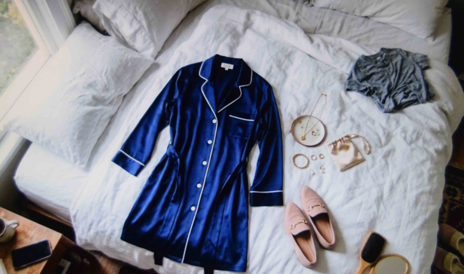 A button through robe laid out among getting ready wedding outfits