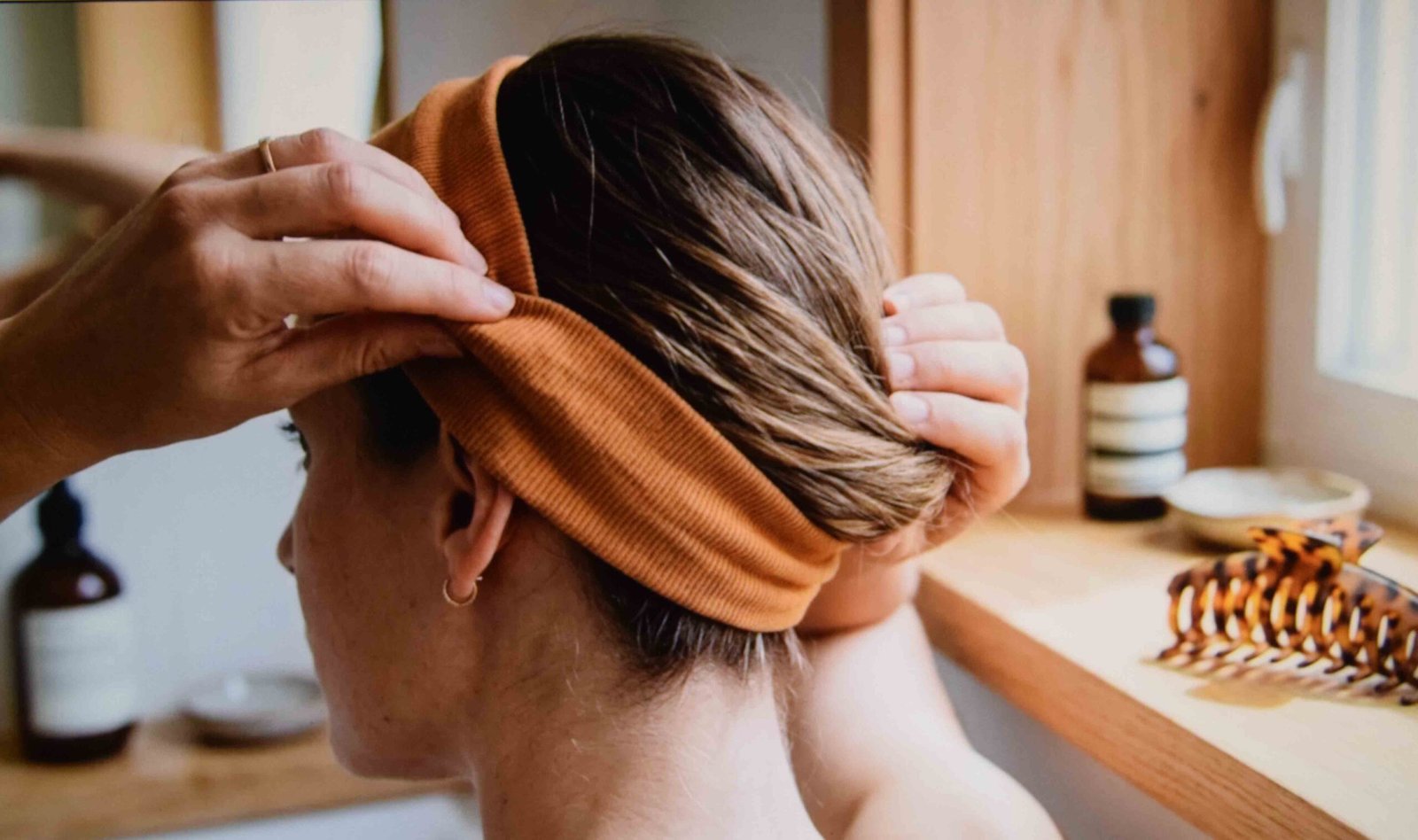 A wide headband positioned to cover the strip where oil shows most