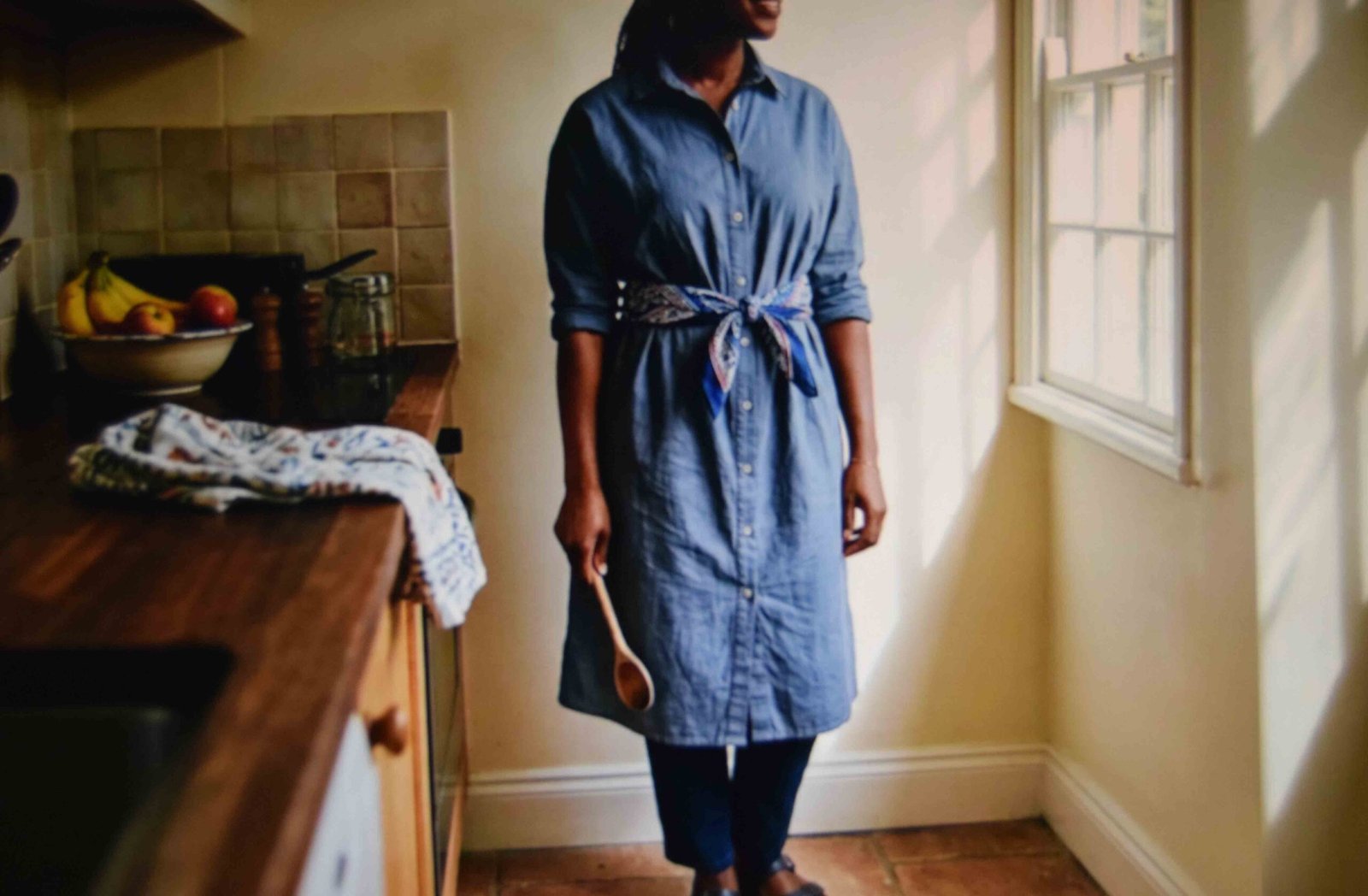Scarf tied at the natural waist over a cotton shirt dress with the fabric behind the placket