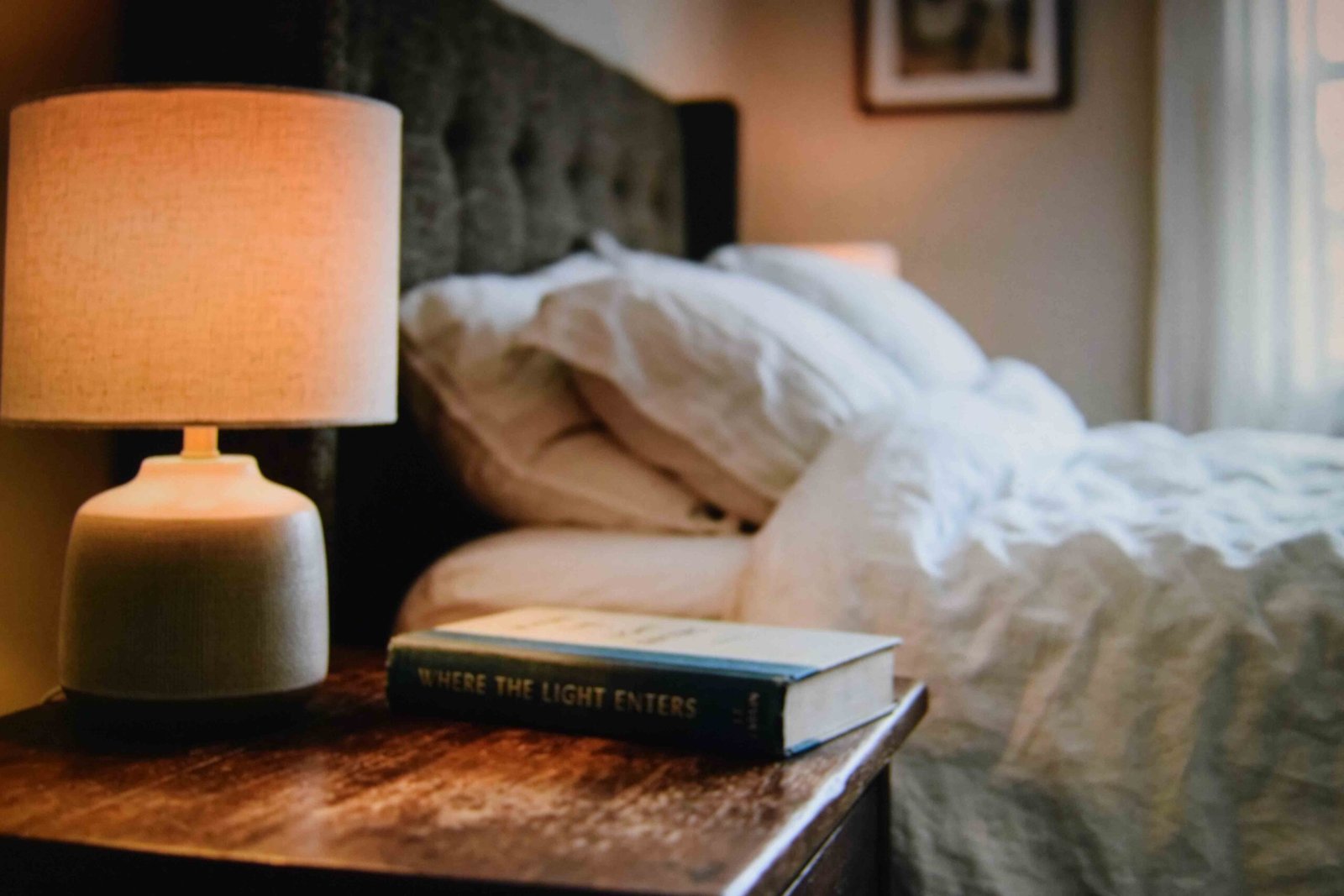 Side table kept to two objects for a restful master bedroom interior