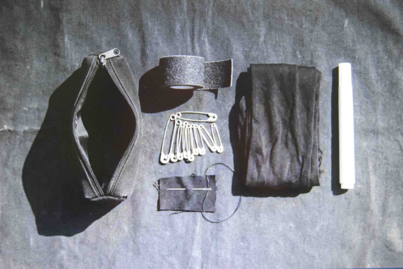 Grip tape pins tights and a stain pen packed as night out emergency fixes