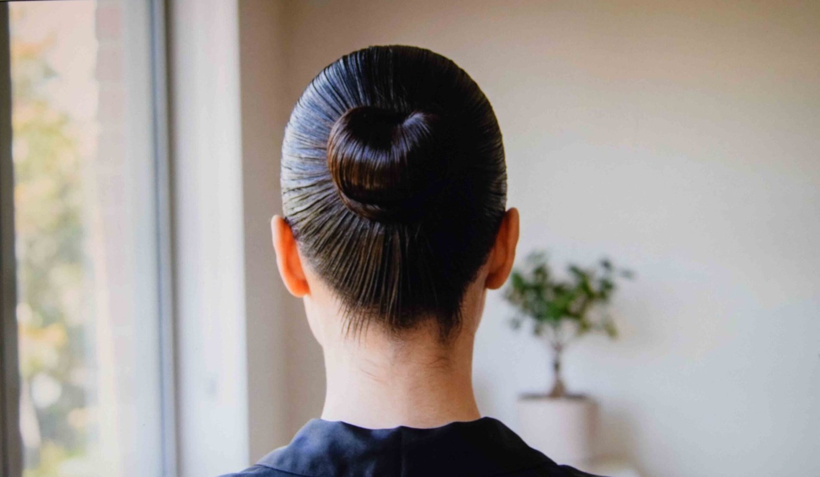 A wet look finish worn as one of the deliberate oiled hair hairstyles