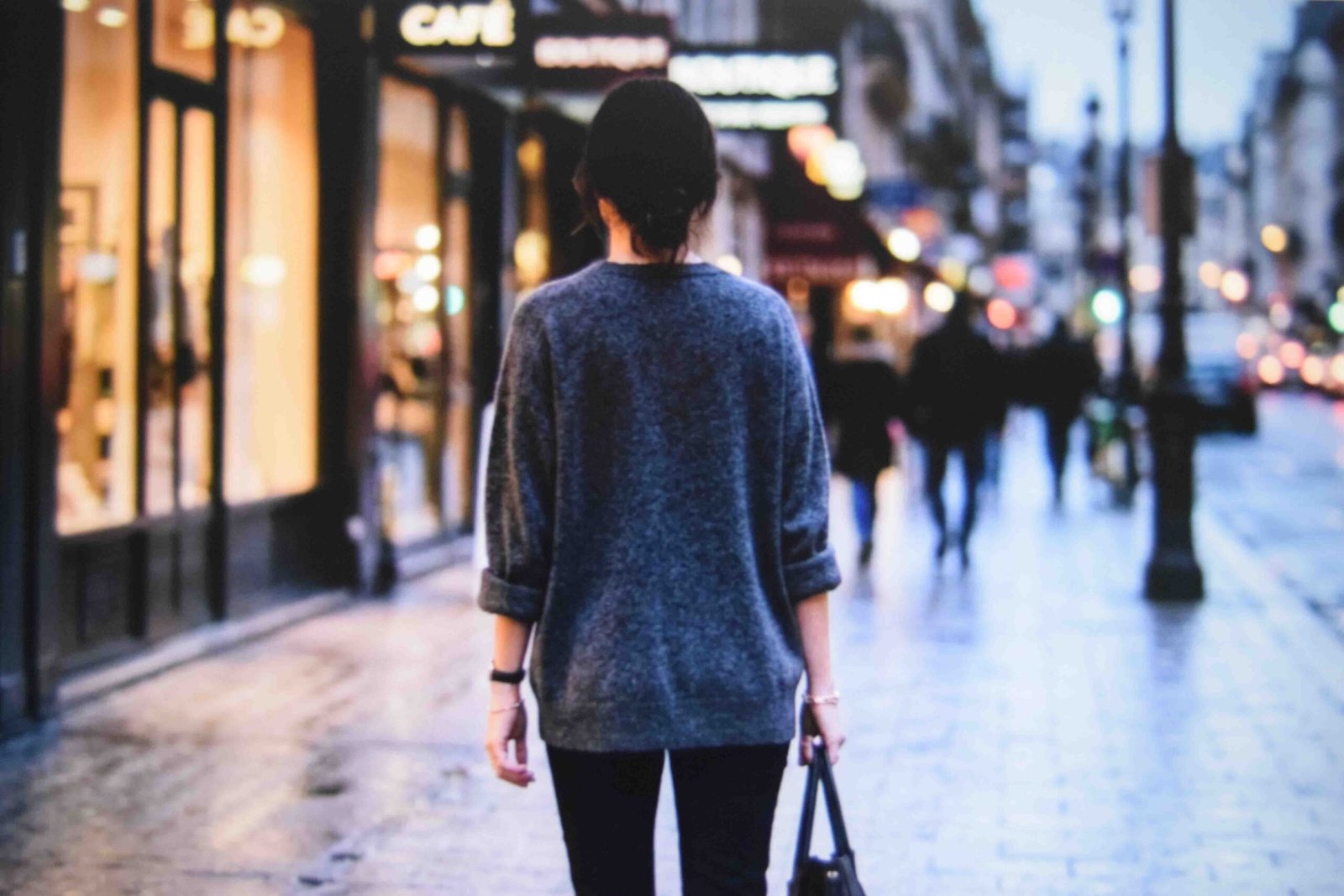 An oversized top over slim trousers among plus size night out outfit ideas