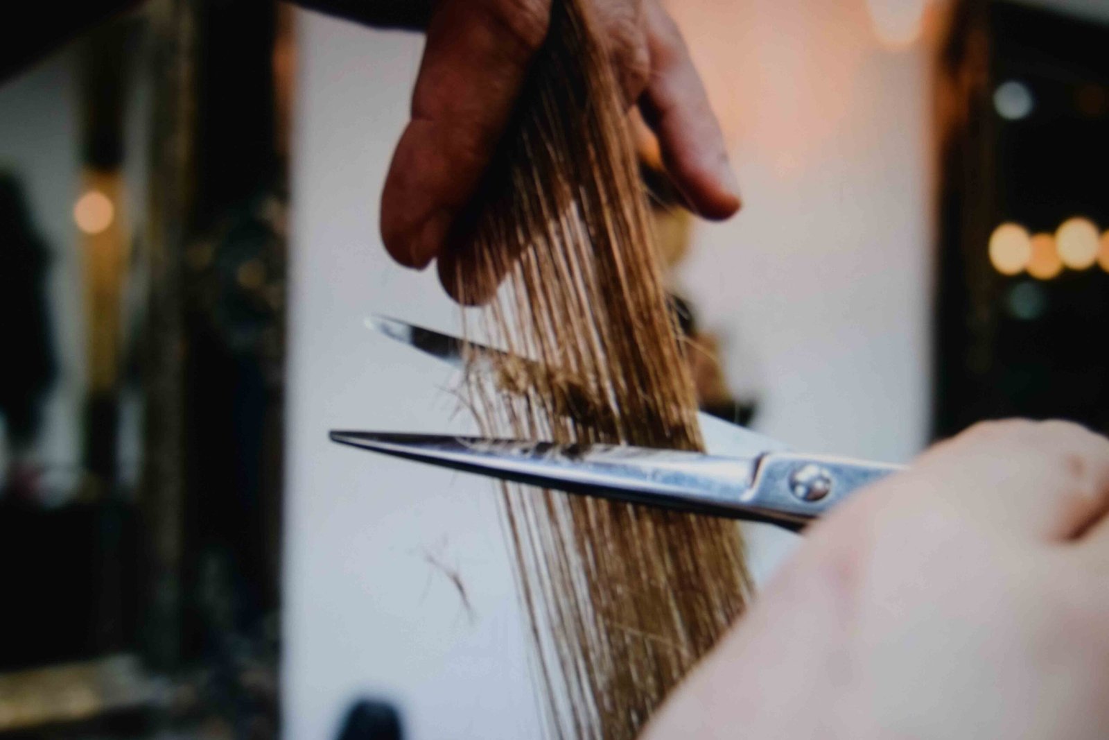 Trimming split ends as part of how to grow out hair fast without losing length