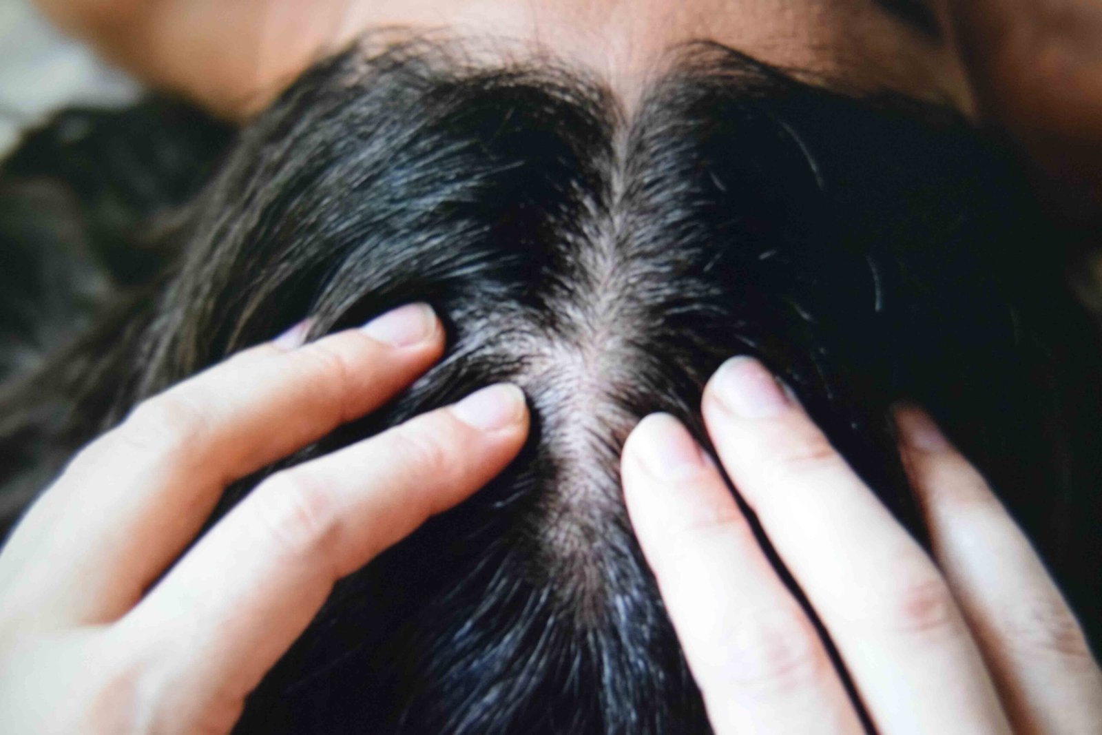 Fingertip scalp massage used to support faster hair growth naturally