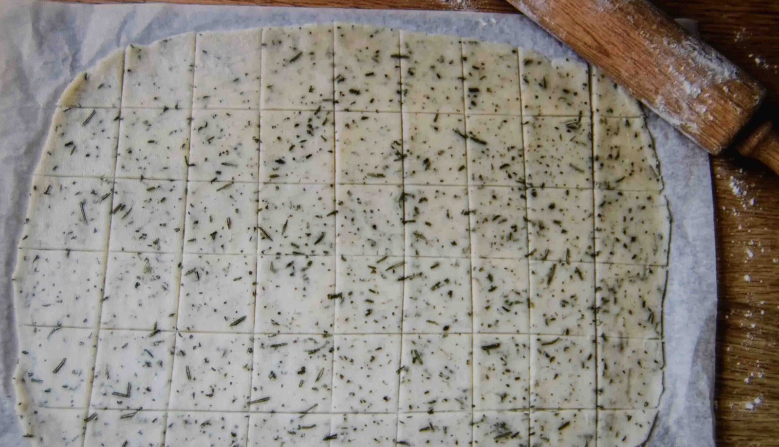 Discard cracker dough rolled thin and scored into squares before baking