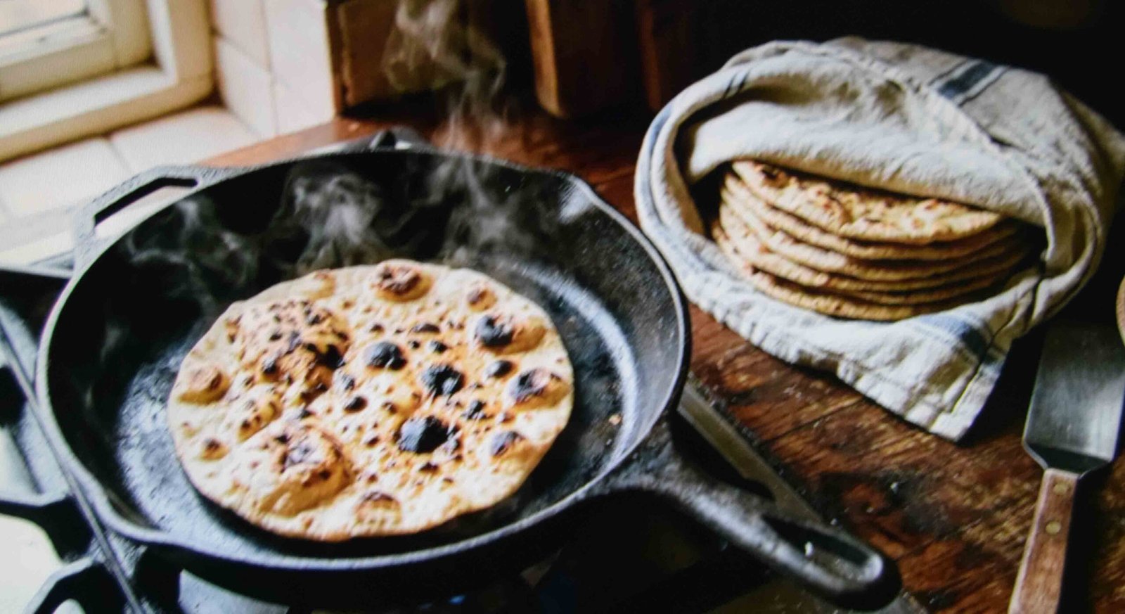 Discard flatbreads blistering in a dry cast iron pan on the stovetop