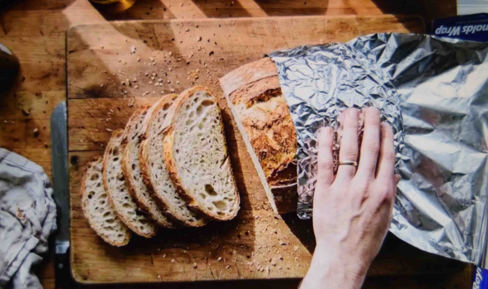 Wrapping pumpkin bread in foil to keep the streusel topping crisp for days