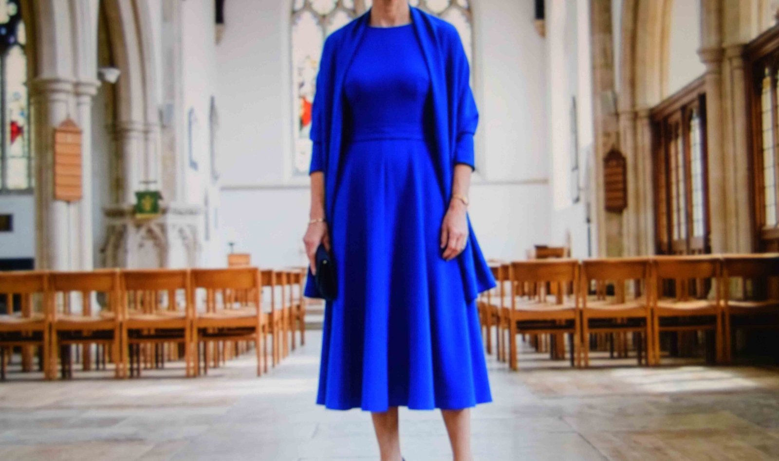 A sleeved crepe midi as one of the wedding outfits for female guests over 60